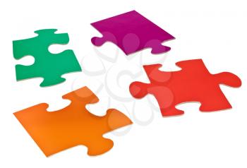 four detached jigsaw puzzle pieces isolated on white background