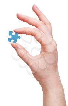 female arm with puzzle piece isolated on white background