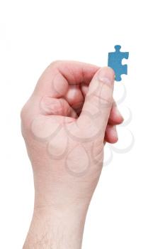 male arm with jigsaw puzzle piece isolated on white background