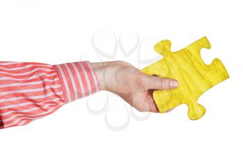 male hand with painted yellow puzzle piece isolated on white background