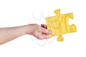 male hand with painted yellow puzzle piece isolated on white background