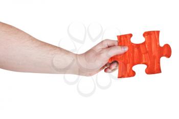 male hand with painted red puzzle piece isolated on white background