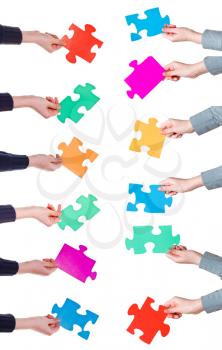 set of female hands with different puzzle pieces isolated on white background