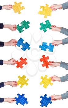 set of female hands with painted puzzle pieces isolated on white background