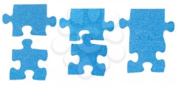 process of connecting of two puzzle pieces isolated on white background