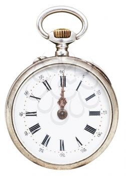 twelve o'clock on the dial of retro pocket watch isolated on white background