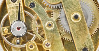 background from brass mechanical clockwork of retro watch close up