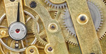 background from brass mechanical movement of retro watch close up