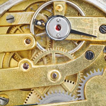 background from brass gear movement of retro watch close up
