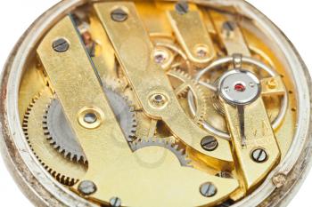 round brass movement of retro pocket watch close up