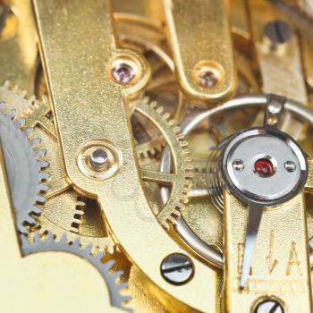 brass mechanical clockwork of vintage watch close up