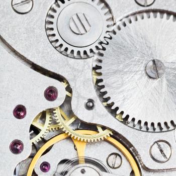 background from steel mechanical movement of retro watch close up