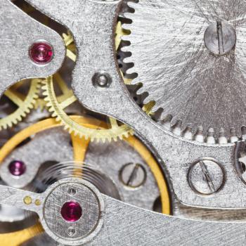 background from steel mechanical movement of vintage clock close up