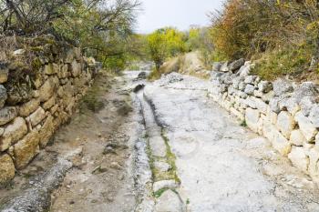 stone road on street of medieval town Chufut-Kale in Crimea