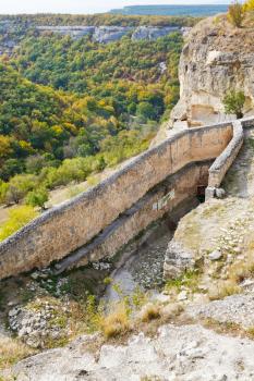 gorge mariam-dere and wall of chufut kale town in Crimean mountains in autumn