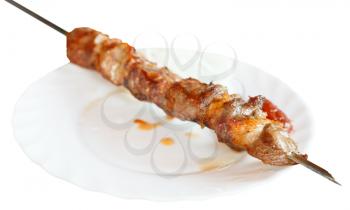 skewer with lamb shishkebab on white plate isolated on white background
