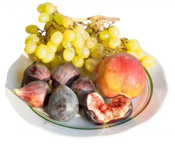 Crimean autumn seasonal fruits on plate isolated on white background