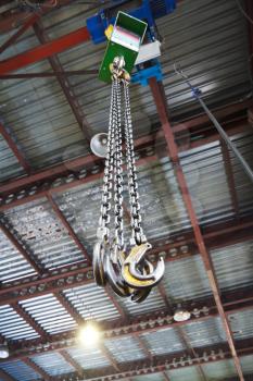 hooks of weigher overhead crane in hangar warehouse