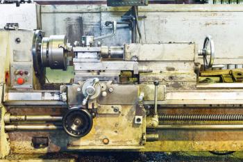 front view of old metal lathe machine in turning workshop