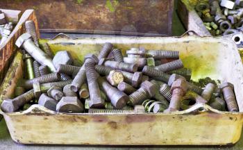 many old bolts in box on workbench in turnery room