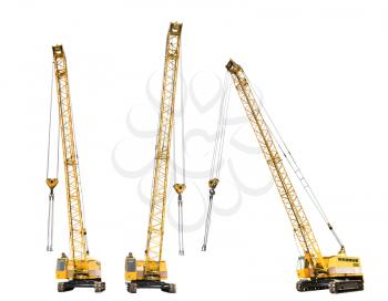 set of construction yellow crawler cranes isolated on white background
