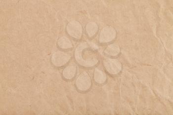 background from sheet of crumpled kraft paper close up