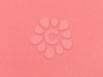 background from sheet of coral colored pastel paper close up