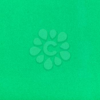 square background from sheet of green color velvet paper close up