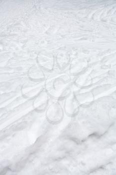 ski runs and paths in snow in winter day