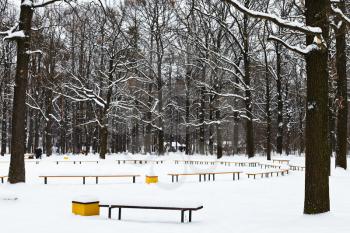 snow covered recreation area in urban park in winter