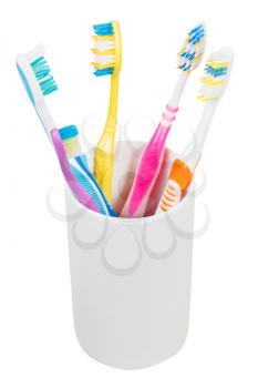 five tooth brushes in ceramic glass - family set of toothbrushes isolated on white background