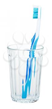 blue toothbrush in glass isolated on white background