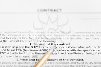 golden pen on sheet of sales contract close up