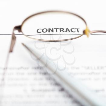 view of sales contract through eyeglasses close up