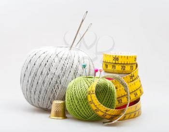 set from few sewing objects on gray background