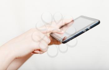 girl holding and clicking touchpad screen