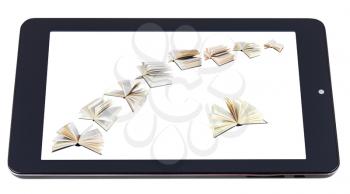 flying books on display of tablet pc isolated on white background