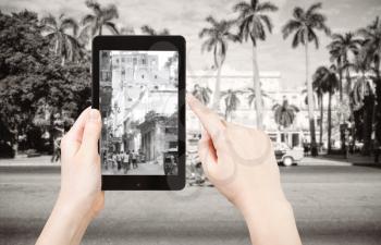 travel concept - tourist taking photo of urban squares in Havana city on mobile gadget, Cuba