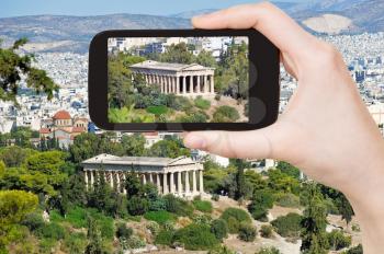 travel concept - tourist taking photo of temple in Athens on mobile gadget, Greece