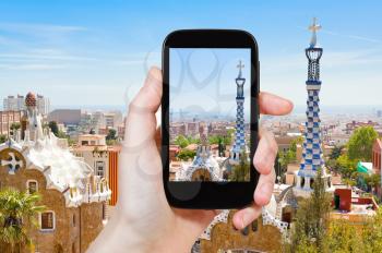 travel concept - tourist taking photo of Barcelona landscape on mobile gadget, Spain
