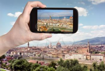 travel concept - tourist taking photo of Florence skyline on mobile gadget, Italy