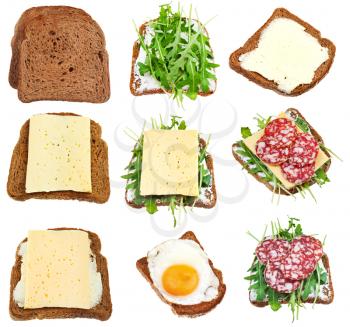 set of sandwiches from toasted brown bread isolated on white background