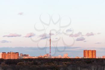 TV tower and urban houses in pink spring sunset, Moscow