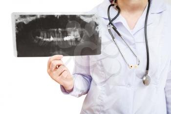 nurse shows X-ray picture with human jaw isolated on white background