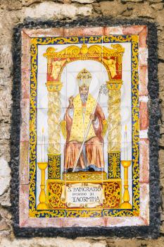 icon of Saint Pancras or Pancratius (San Pancrazio) of Taormita - patron Saint of Taormina town on the urban house wall, Sicily, Italy