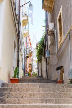 narrow street via Ciraulo in Catania city, Sicily, Italy