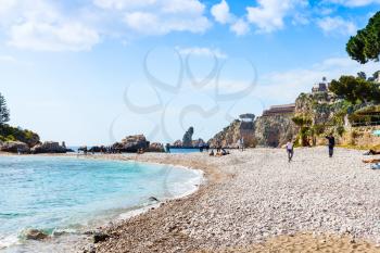TAORMINA, ITALY - APRIL 3, 2015: beach Isola Bella island on Ionian Sea, Sicily. Also known as The Pearl of the Ionian Sea in 1990 the island being turned into nature reserve, administrated by WWF