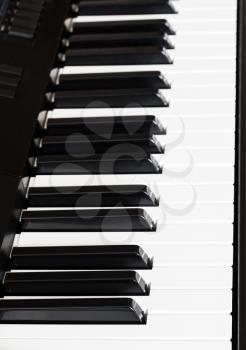 side view of black and white keys of digital sequencer close up