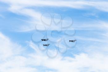 military transport aircrafts in white clouds in blue sky