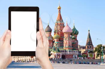 travel concept - tourist photograph Pokrovskiy cathedral, Red Square with Vasilevsky descent in Moscow, Russia on tablet pc with cut out screen with blank place for advertising logo